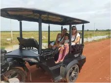 A couple of women in a tuk tuk